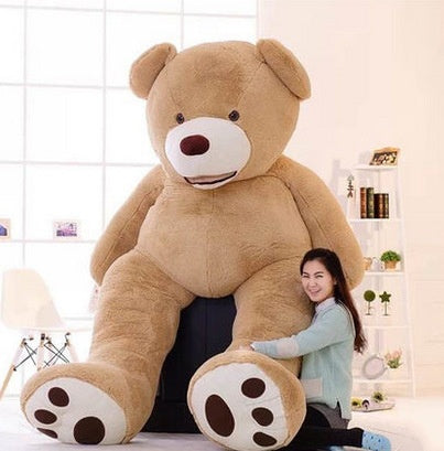 Large life-size teddy bear with soft, plush fur, perfect for cuddling and decorative display.