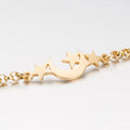 Stainless steel Xingyue bracelet with intricate design, showcasing sleek, polished metal links on a neutral background.