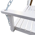 White wooden porch swing with a classic design, featuring sturdy armrests and a slatted seat, ideal for outdoor relaxation.