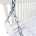White wooden porch swing with classic design, featuring a sturdy frame and slatted seat, perfect for outdoor relaxation.
