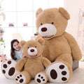 Large, life-size teddy bear with soft brown fur, plush paws, and friendly expression, perfect for cuddling and decorating.