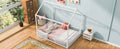 Modern twin wood house bed frame with a cozy house-shaped headboard and sturdy wooden construction.