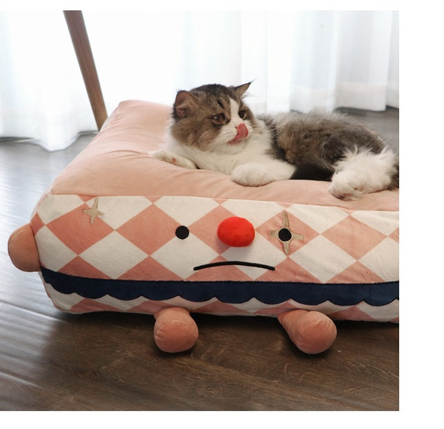 Clown Pet Sleeps In A Cozy Pet Bed null
