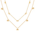 European and American style stainless steel necklace with flat cross chain and bow pendant, displayed on a neutral background.