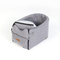 Luxury central console dog car seat with padded interior and safety straps for secure and comfortable travel.