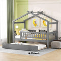 Twin size wooden house bed with attached trundle, featuring a cozy house-shaped design and natural wood finish.