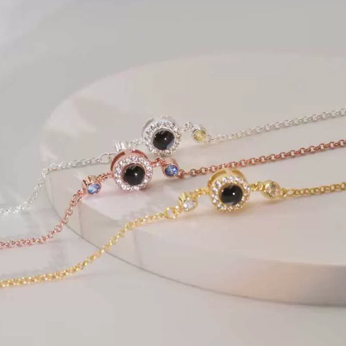 Unisex copper round birthstone bracelet with a polished finish and a central gemstone, stylish and adjustable jewelry accessory.