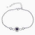 Unisex copper round birthstone bracelet with a polished finish, featuring a colorful gemstone set in a sleek design.
