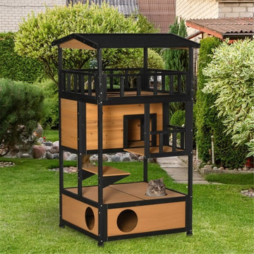 Multi-level outdoor cat house and play tower with multiple platforms, ramps, and cozy hiding spots for cats to explore and rest.