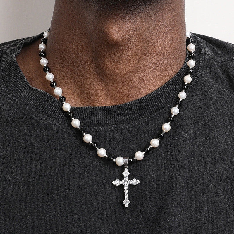 Natural freshwater pearl and black agate necklace with a cross pendant, showcasing elegant jewelry design and craftsmanship.