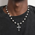 Natural freshwater pearl and black agate necklace with a cross pendant, showcasing elegant jewelry design and craftsmanship.