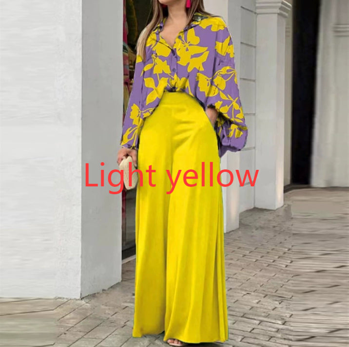 Vibrant abstract print blouse and wide-leg trousers set, stylish fashion ensemble with colorful patterns and comfortable fit.