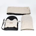 Luxury central console dog car seat in black with padded interior and adjustable straps for secure travel comfort.