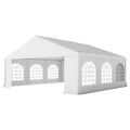 Wooden gazebo with open sides and a shingled roof, surrounded by lush greenery in a garden setting