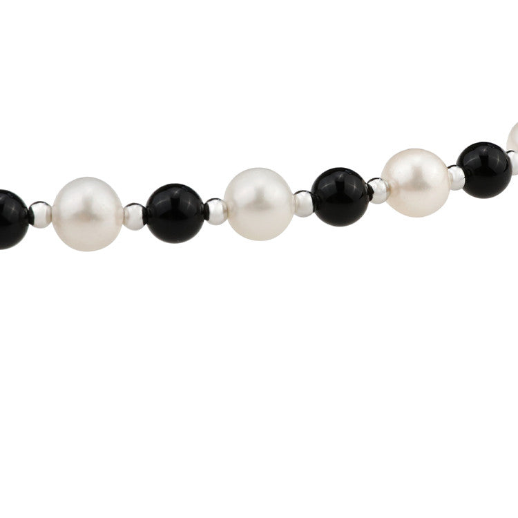 Natural freshwater pearl and black agate necklace with a cross pendant, featuring elegant gemstone details.