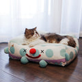 Clown Pet Sleeps In A Cozy Pet Bed null