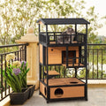 Multi-level outdoor cat house and play tower with multiple platforms and cozy hideouts for cats to climb and relax outside.