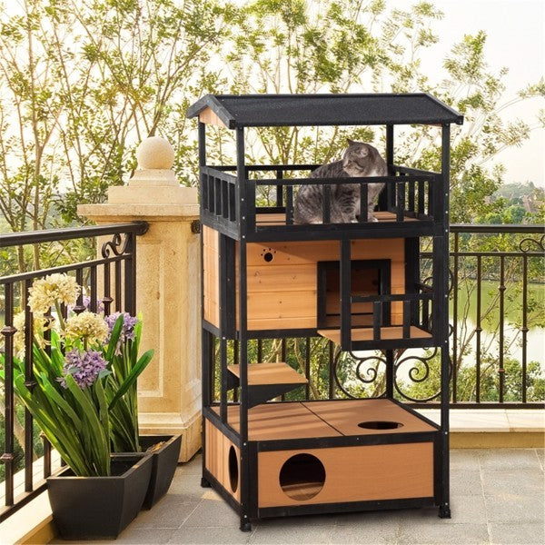 Multi-level outdoor cat house and play tower with multiple platforms and cozy hideouts for cats to climb and relax outside.