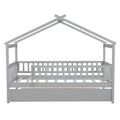 Twin size wooden house bed with built-in trundle, featuring a cozy house-shaped design, ideal for kids' bedrooms.