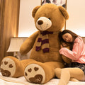 Large oversized teddy bear action stuffed toy with soft, plush fur and a friendly appearance, perfect for cuddling and gift-giving.