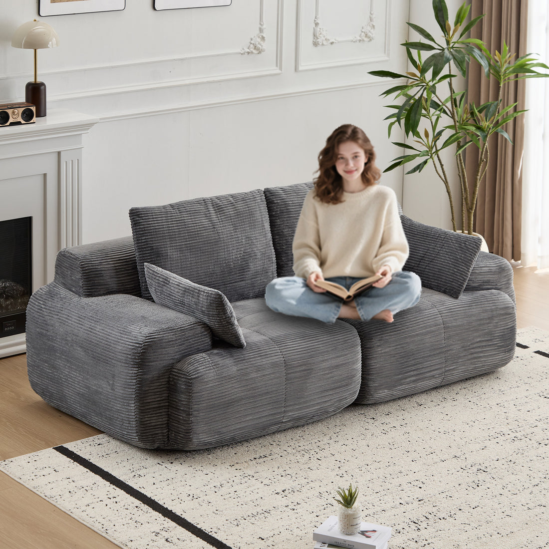 Soft beige luxury wide-wale corduroy cloud couch with plush cushions and curved design, ideal for modern living rooms.