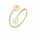 Close-up of a double freshwater pearl open ring showcasing two elegant pearls on a sleek silver band.
