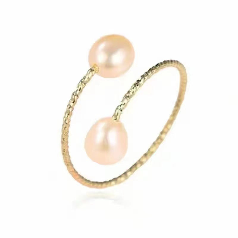 Close-up of a double freshwater pearl open ring showcasing two elegant pearls on a sleek silver band.