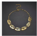 Stainless steel hollow oval leaf engraved bracelet with a colorful birthstone accent, elegant jewelry accessory.