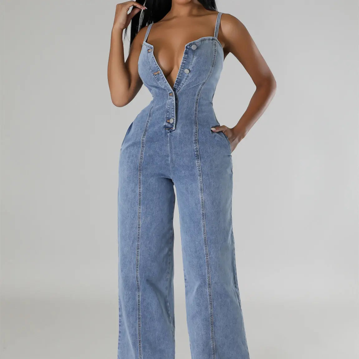 Light blue denim jumpsuit with suspenders, featuring a mid-waist and straight-leg design, ideal for women's fashion.