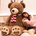 Large oversized teddy bear stuffed toy with soft, plush fur and a friendly expression, perfect as a cuddly big bear doll.