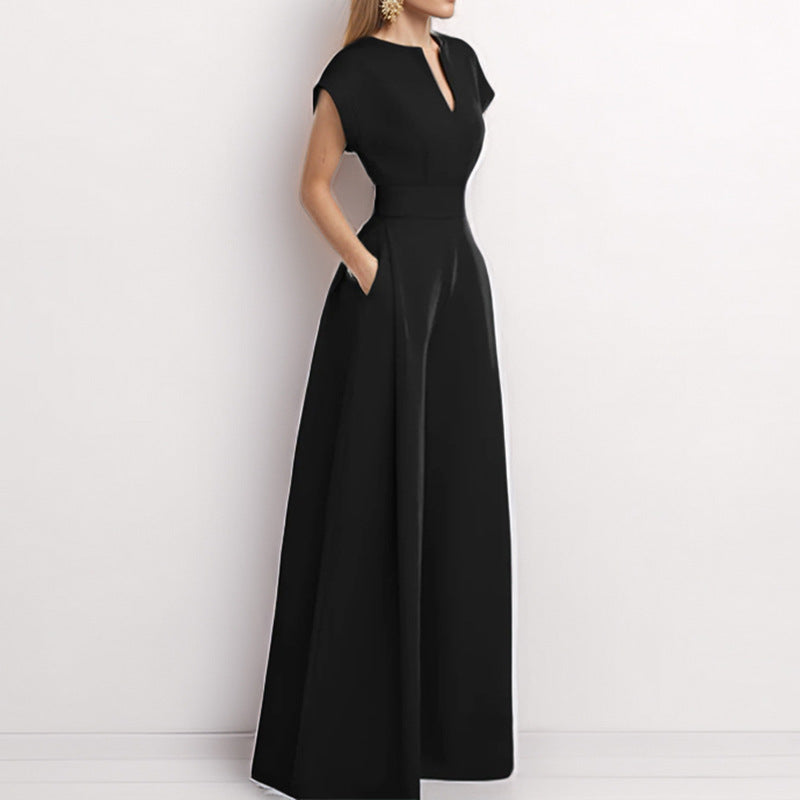 Architectural V-Neck Wide-Leg Jumpsuit in neutral fabric, featuring a stylish V-neckline and flowing wide-leg design.