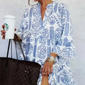 Blue printed slit V-neck dress for women, featuring 97% polyester and 3% spandex material.