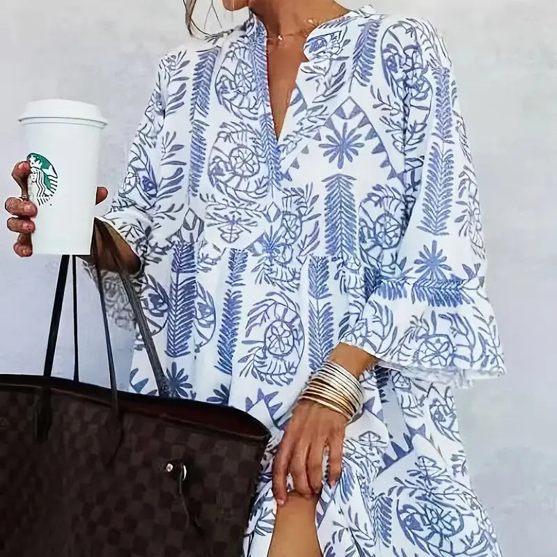 Blue printed slit V-neck dress for women, featuring 97% polyester and 3% spandex material.