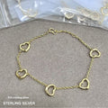 18K gold plated open heart station chain bracelet with delicate heart charms and elegant design.